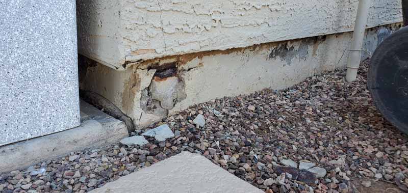 Concrete Repairman conducting a Foundation Inspection during a real estate transaction — schedule your inspection today for a safe and informed home sale or purchase.