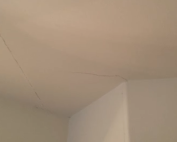 Drywall cracks in a home with signs of foundation damage. Contact Concrete Repairman LLC at (480) 725-7614 for a professional inspection and repair plan to protect your home.